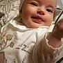 Freya is registered to the contest to win money with this photo: baby, smiling, headband, bow, white_clothing, animal_print, hedgehog, bear, mushroom, blanket, infant, cute, reaching_hand, face, child, indoors, closeup, happy, portrait, soft_light