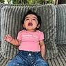Mikiyo joined the competition — help win amazing prizes! baby, child, pink_shirt, blue_jeans, jeans, couch, cushion, indoor, happy, smiling, person, plush, clothing, earrings, baby_girl, text_on_clothing, plant, comfort, seated, portrait