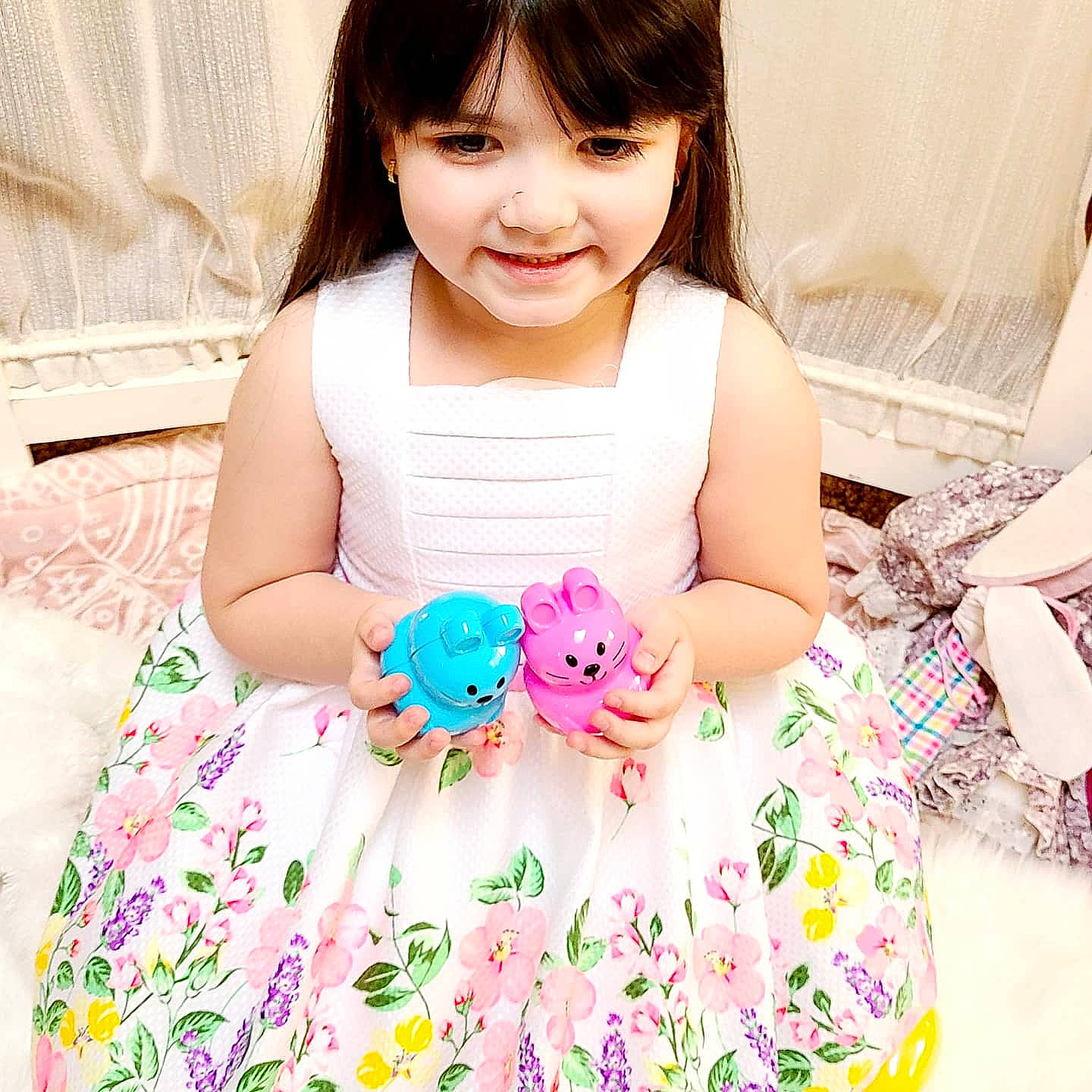 Jacklyn is registered to the contest to win money with this photo: baby_toddler_clothing, child, clothing, dress, eyelash, facial_expression, finger, hairstyle, happy, human, joy, neck, person, petal, pink, product, skin, sleeve, smile, t_shirt