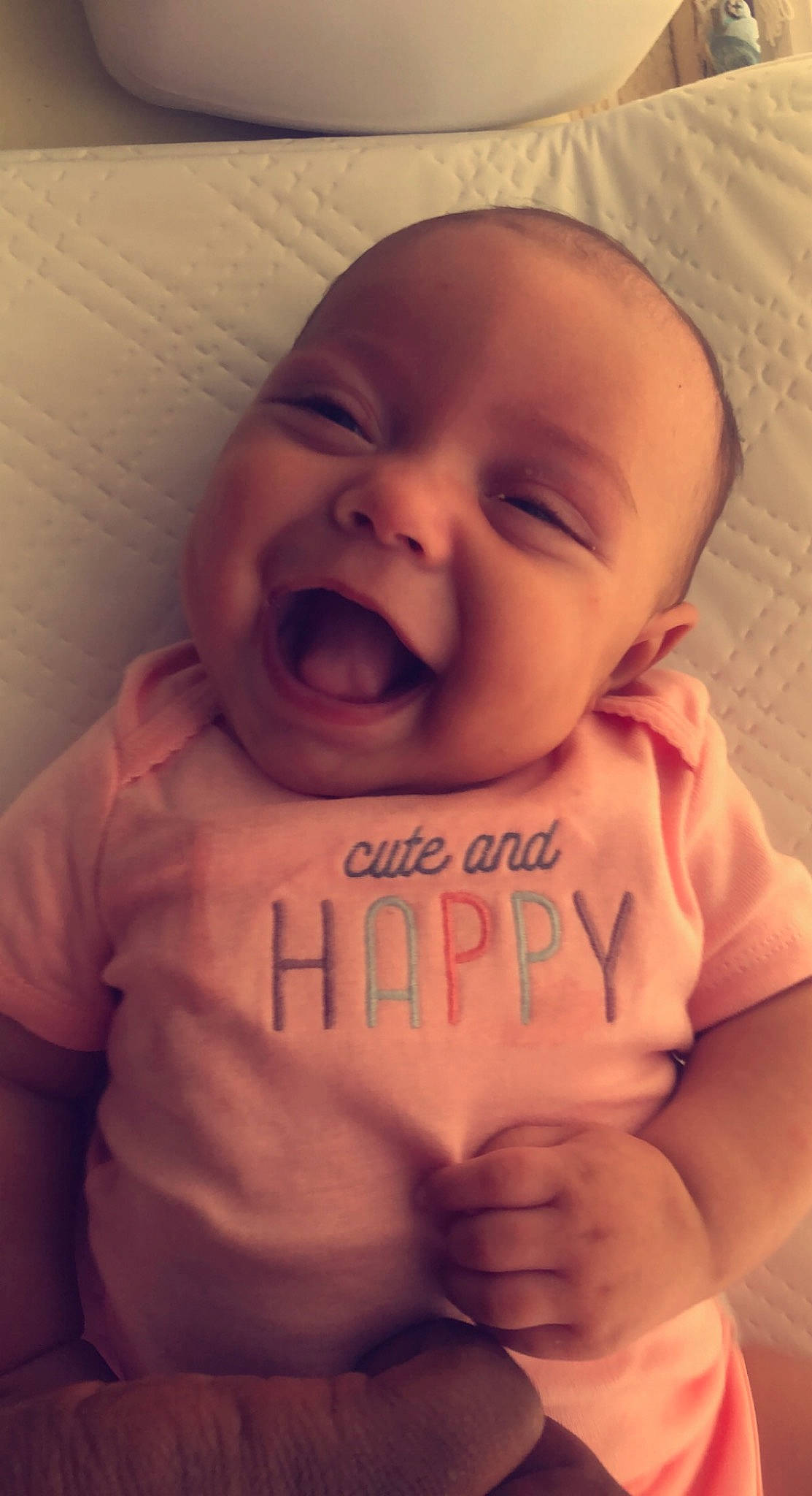 Ensley is registered to the contest to win money with this photo: baby, cheek, chin, eye, eyebrow, face, facial_expression, happy, head, human_body, lip, mouth, muscle, neck, nose, organ, person, product, skin, sleeve