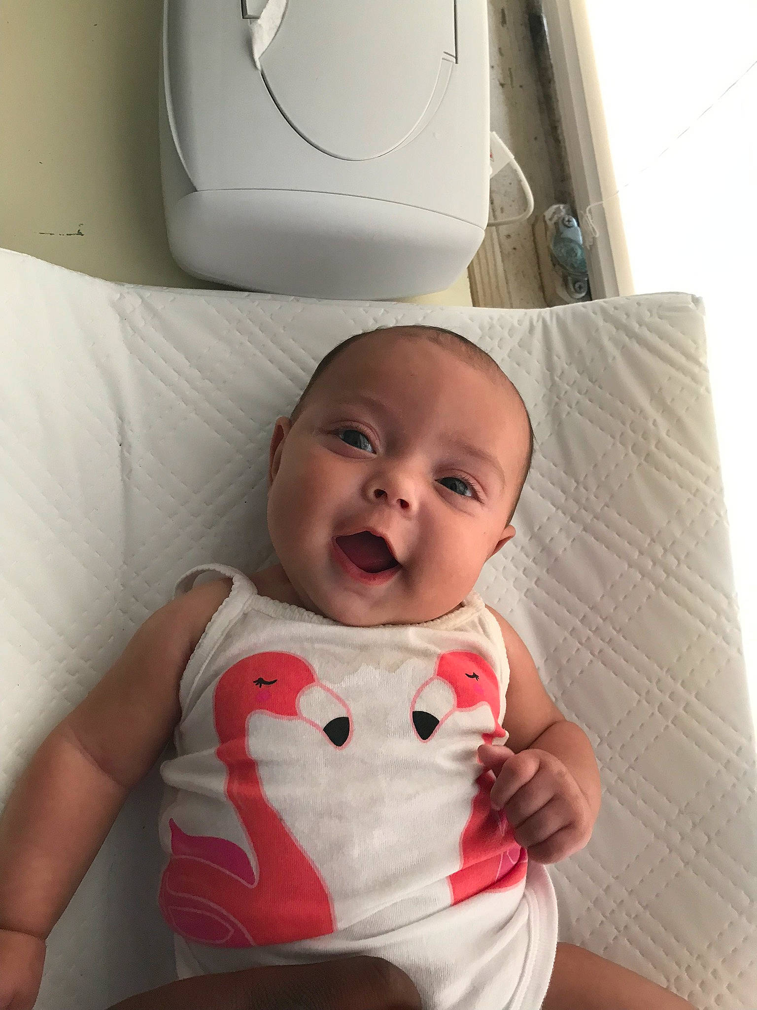 Ensley is registered to the contest to win money with this photo: baby, baby_toddler_clothing, cheek, child, comfort, dress, happy, head, linens, lip, mouth, neck, person, product, sitting, skin, sleeve, smile, t_shirt, toddler