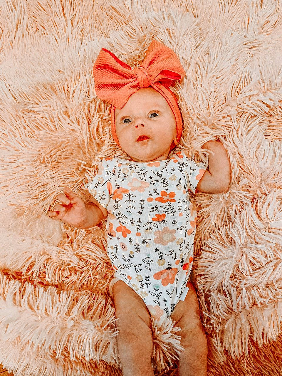 Charlie is registered to the contest to win money with this photo: art, baby, baby_toddler_clothing, child, costume_hat, eye, fashion_accessory, fur, grass, happy, human_leg, pattern, peach, people_in_nature, person, pink, skin, stock_photography, textile, thigh