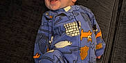 Cam is registered to the contest to win money with this photo: animal, baby, babylaughing, bird, blanket, chair, clothing, couch, dress, face, formalwear, furniture, happy, head, pajamas, penguin, person, photography, portrait, smile