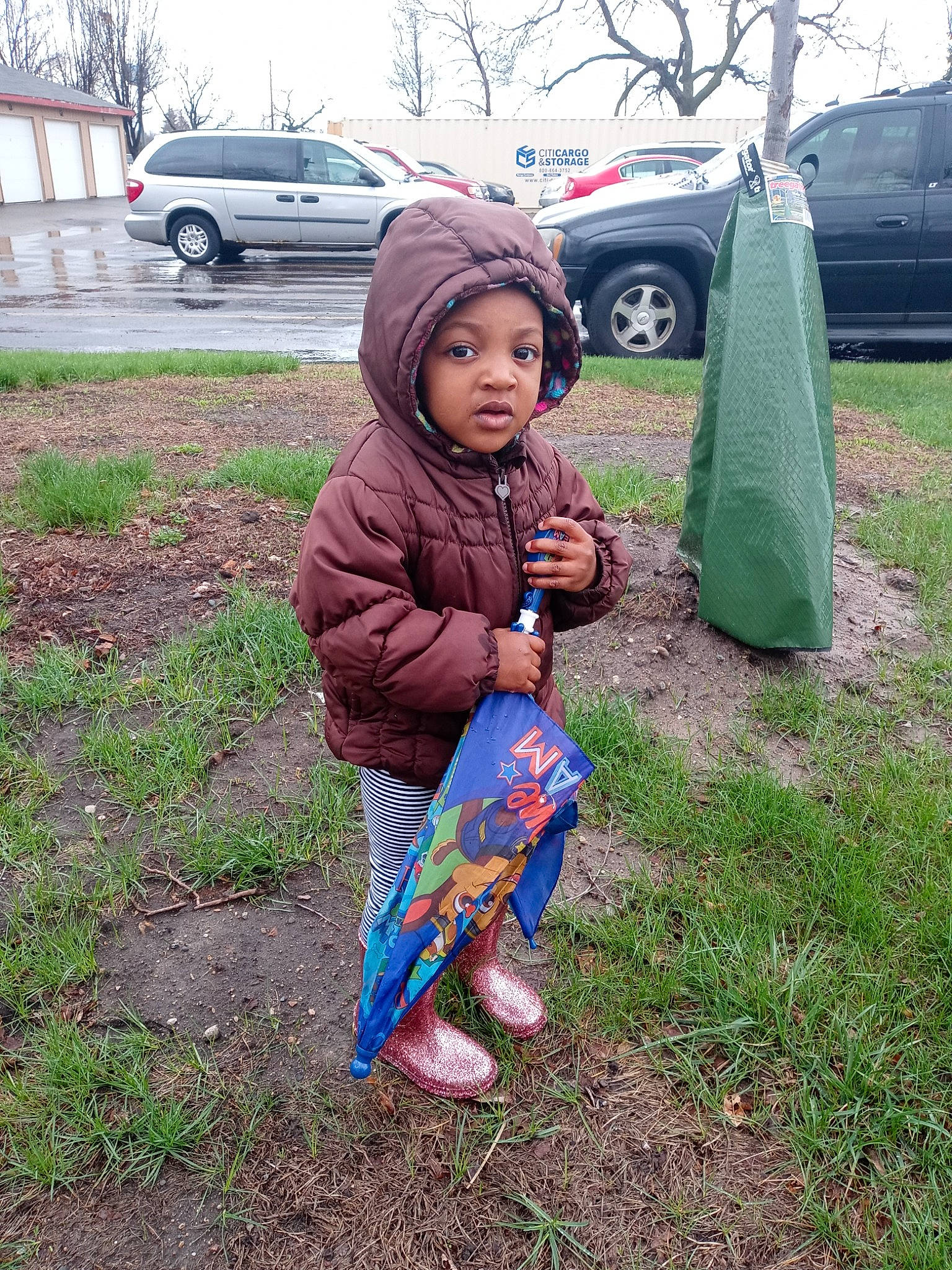 Amara joined the competition — help win amazing prizes! asphalt, automotive_tire, baby, car, grass, grass_family, happy, headwear, human_body, land_vehicle, lawn, leaf, people_in_nature, person, plant, recreation, tire, toddler, tree, vehicle