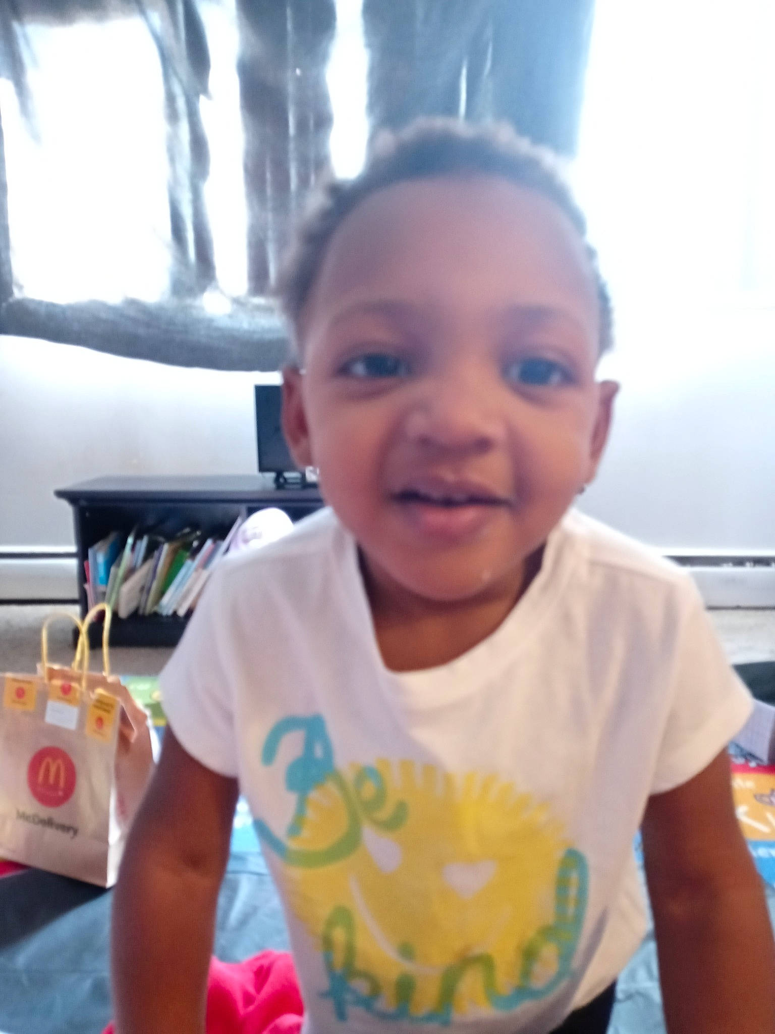 Amara is registered to the contest to win money with this photo: cheek, child, cool, electronic_device, face, facial_expression, finger, forehead, fun, hairstyle, happy, iris, joy, leisure, mouth, nose, person, sleeve, smile, t_shirt