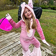 Brynlee joined the competition — help win amazing prizes! child, girl, costume, pink, bunny, outdoor, grass, wooden_deck, bucket, smile, playful, autumn, trees, gloves, long_hair, footwear, nature, holiday, festive, fun