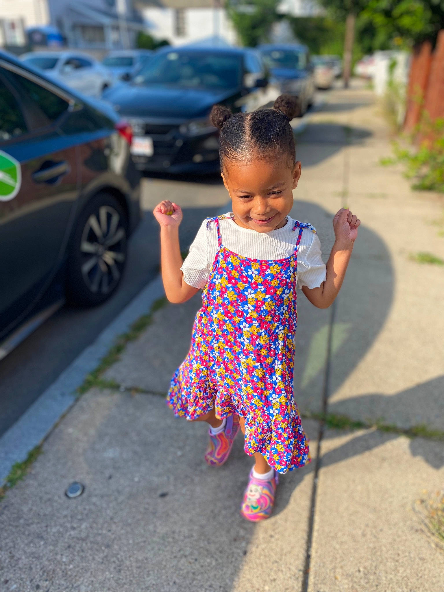 Amiya is registered to the contest to win money with this photo: asphalt, car, grass, happy, joy, leisure, morning, person, pink, plant, public_space, recreation, road, road_surface, sidewalk, smile, tire, toddler, tree, vehicle_door