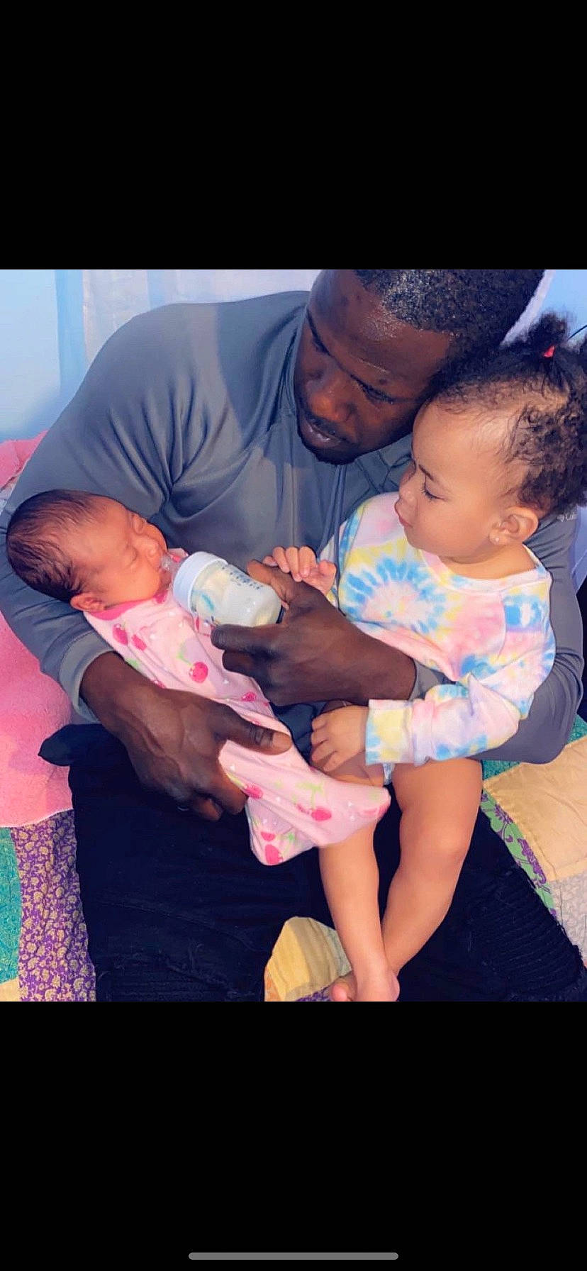 Amiya is registered to the contest to win money with this photo: baby, baby_toddler_clothing, cheek, child, comfort, event, facial_expression, finger, fun, gesture, happy, interaction, lap, mouth, muscle, person, pink, purple, skin, t_shirt