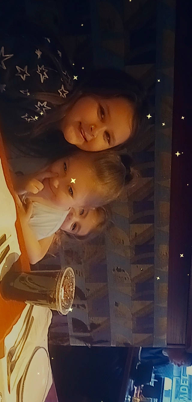 Elyse is registered to the contest to win money with this photo: cheek, child, darkness, flash_photography, fun, glass, hairstyle, happy, human_body, joy, midnight, mouth, night, person, portrait_photography, room, smile, space, toddler, wood