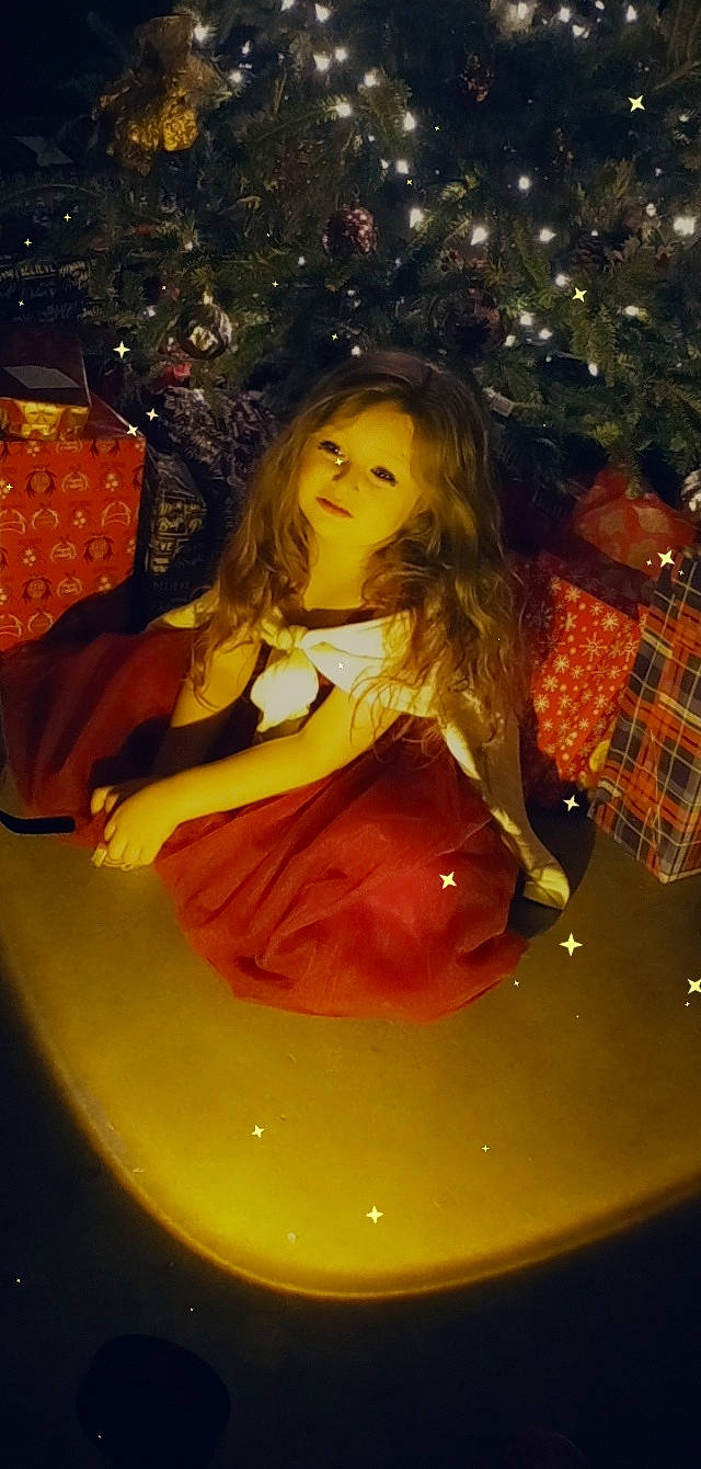 Ellie joined the competition — help win amazing prizes! blond, brown_hair, child, christmas_ornament, christmas_tree, design, dress, event, eye, fun, hair, happy, head, human_body, human_leg, long_hair, ornament, person, plaid, tartan