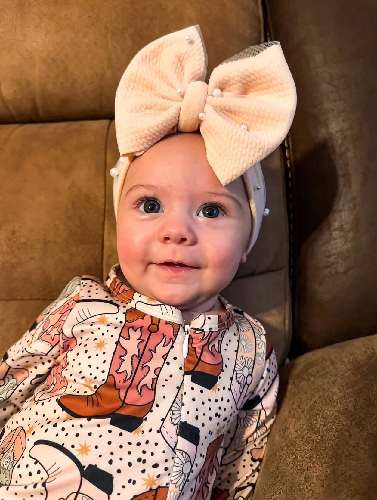Sutton is registered to the contest to win money with this photo: baby, baby_toddler_clothing, cap, chin, comfort, costume_hat, eye, eyebrow, face, fashion_accessory, happy, hat, head, headgear, headwear, joy, nose, outerwear, person, skin
