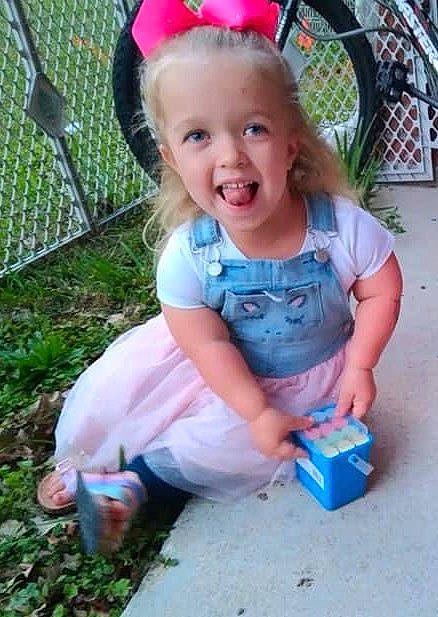 Hannah joined the competition — help win amazing prizes! baby_toddler_clothing, child, electric_blue, fashion_accessory, fun, grass, happy, headband, headpiece, leisure, magenta, pattern, person, pink, play, recreation, sitting, smile, summer, t_shirt