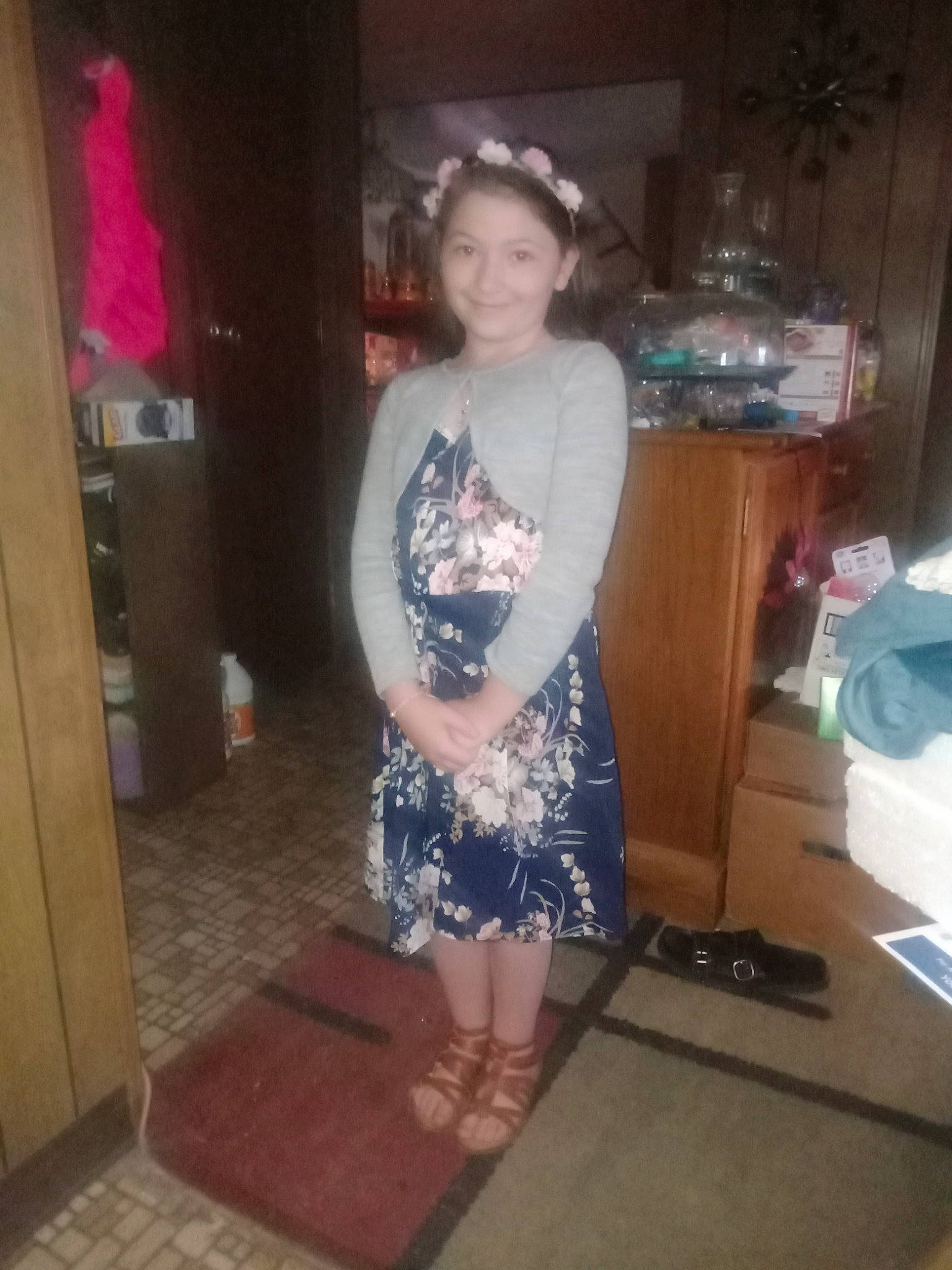 Angelina is registered to the contest to win money with this photo: barefoot, child, costume, fashion_design, floor, flooring, foot, fun, hardwood, human_leg, joy, knee, pattern, person, room, sandal, smile, thigh, trunk, vintage_clothing