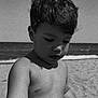child, beach, ocean, water, sand, portrait, black_and_white, bare_chest, curly_hair, young, outdoor, summer, nature, shore, vacation, holiday, sky, person, daylight, closeup