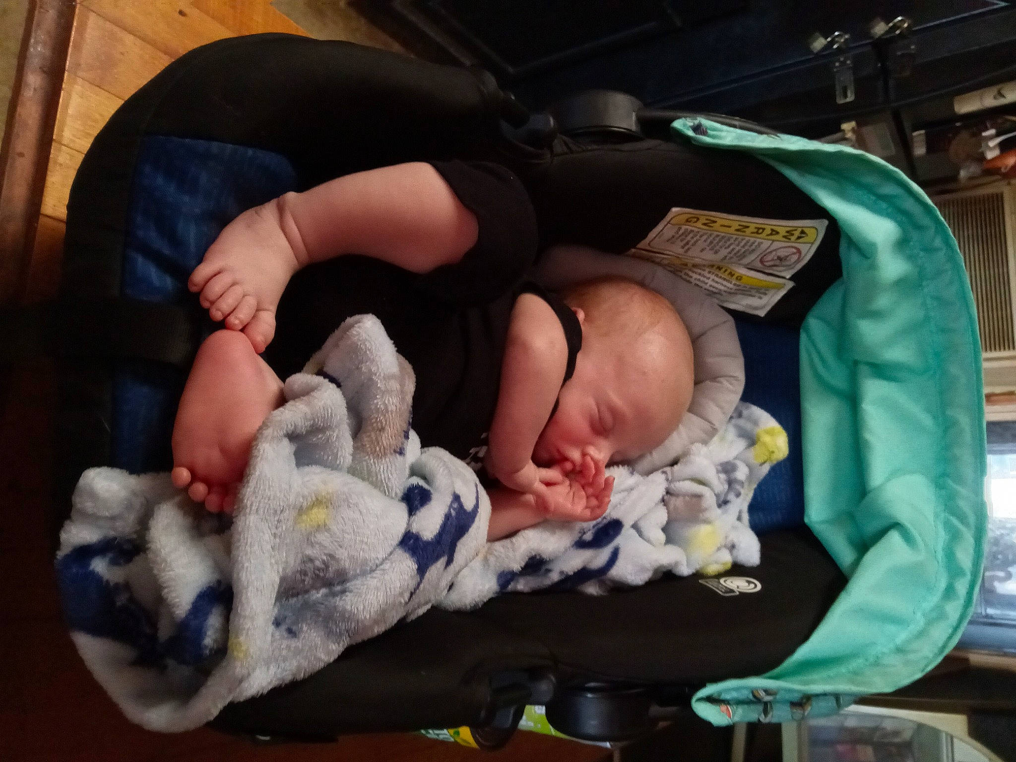 Daniel is registered to the contest to win money with this photo: baby, baby_products, baby_safety, baby_toddler_clothing, child, comfort, foot, lap, person, room, sitting, thumb, toddler