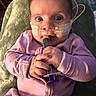 Jaylee joined the competition — help win amazing prizes! baby, blanket, child, cozy, curiosity, face, hands, healthcare, indoor, infant, medical_tape, nasal_tube, orange_flowers, person, portrait, purple_onesie, soft_lighting, syringe, toddler, wide_eyes