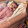 Jaylee is registered to the contest to win money with this photo: baby, bassinet, bed, blanket, child, cozy, cute, face, happy, heart_pattern, indoor, infant, medical_tape, nasal_cannula, person, pink_onesie, plush_toy, rest, smile, soft_fabric