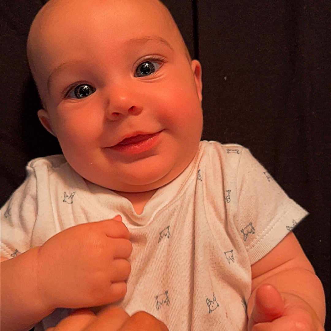 Maverick is registered to the contest to win money with this photo: baby, bodypart, face, finger, hand, happy, head, mouth, nail, newborn, person, photography, portrait, smile, toe, wrist