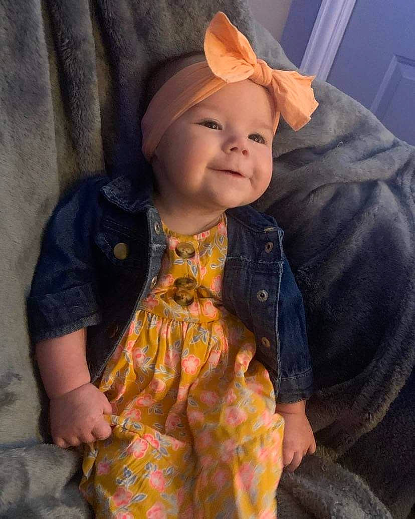 Francesca is registered to the contest to win money with this photo: baby, baby_toddler_clothing, cap, cheek, eye, eyebrow, face, happy, head, headwear, iris, jacket, joy, lip, nose, outerwear, person, skin, sleeve, smile