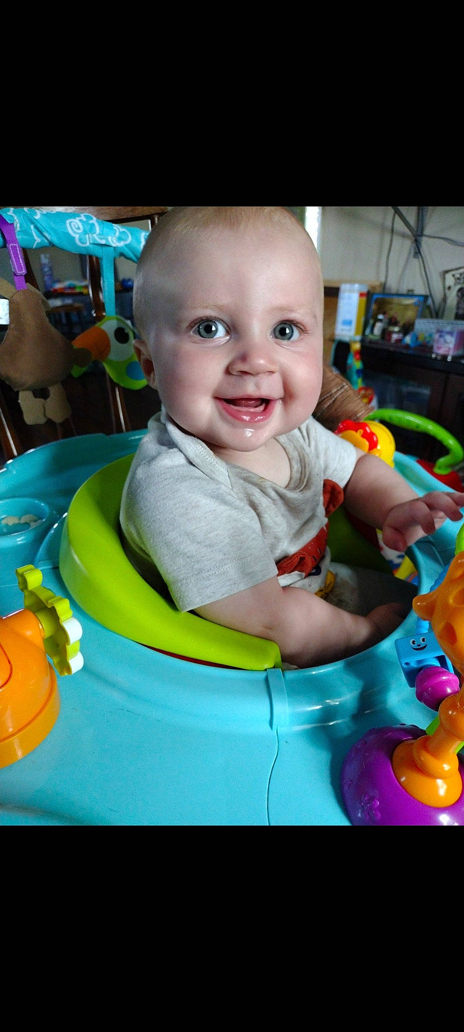 Tucker is registered to the contest to win money with this photo: baby, baby_playing_with_toys, baby_products, baby_toddler_clothing, baby_toys, child, event, facial_expression, fun, happy, head, joy, leisure, person, play, product, recreation, room, sitting, smile
