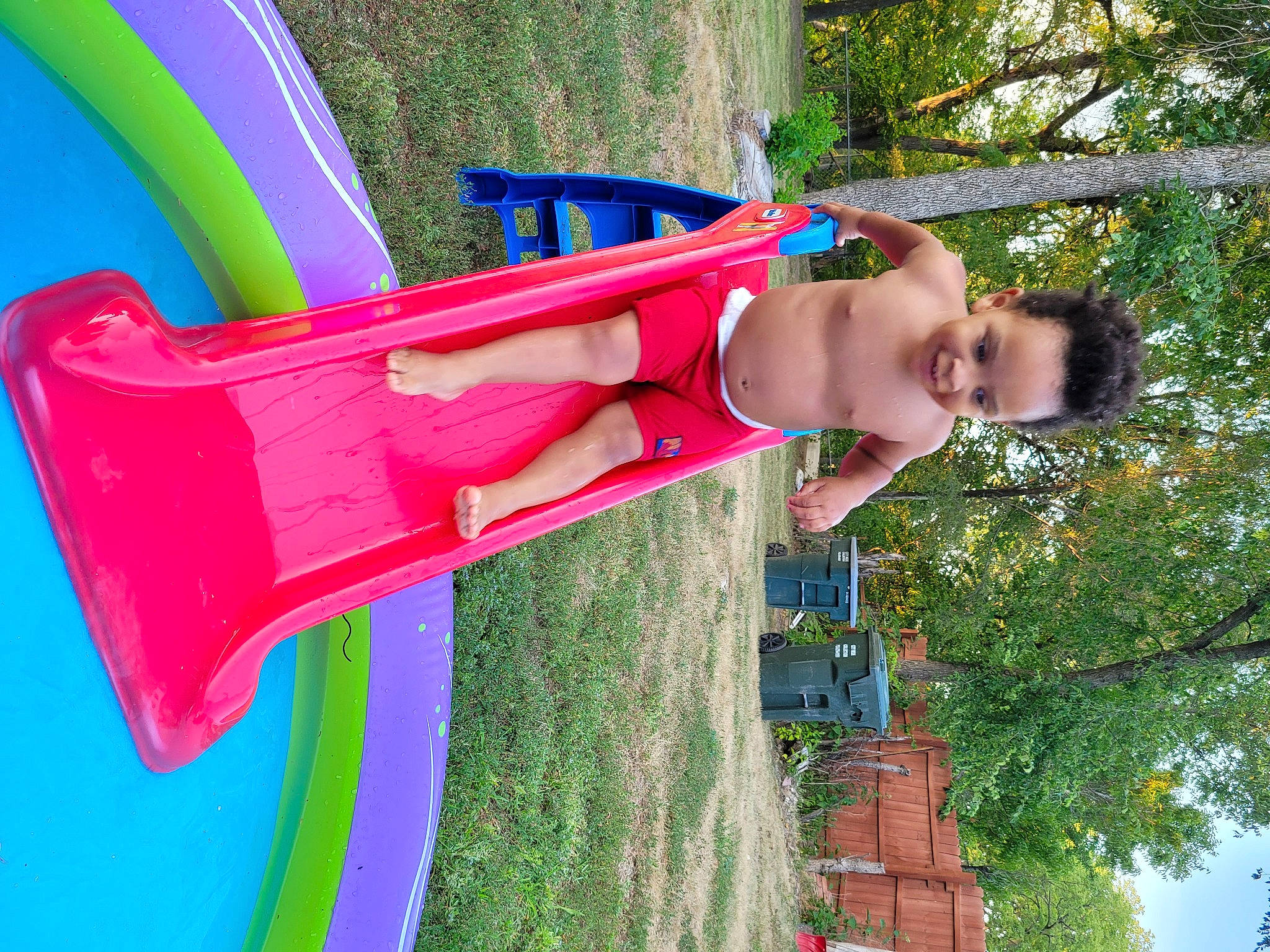 Tahj joined the competition — help win amazing prizes! art, beauty, child, chute, city, fun, grass, green, happy, human_body, leisure, magenta, outdoor_play_equipment, people_in_nature, person, plant, playground, playground_slide, recreation, summer