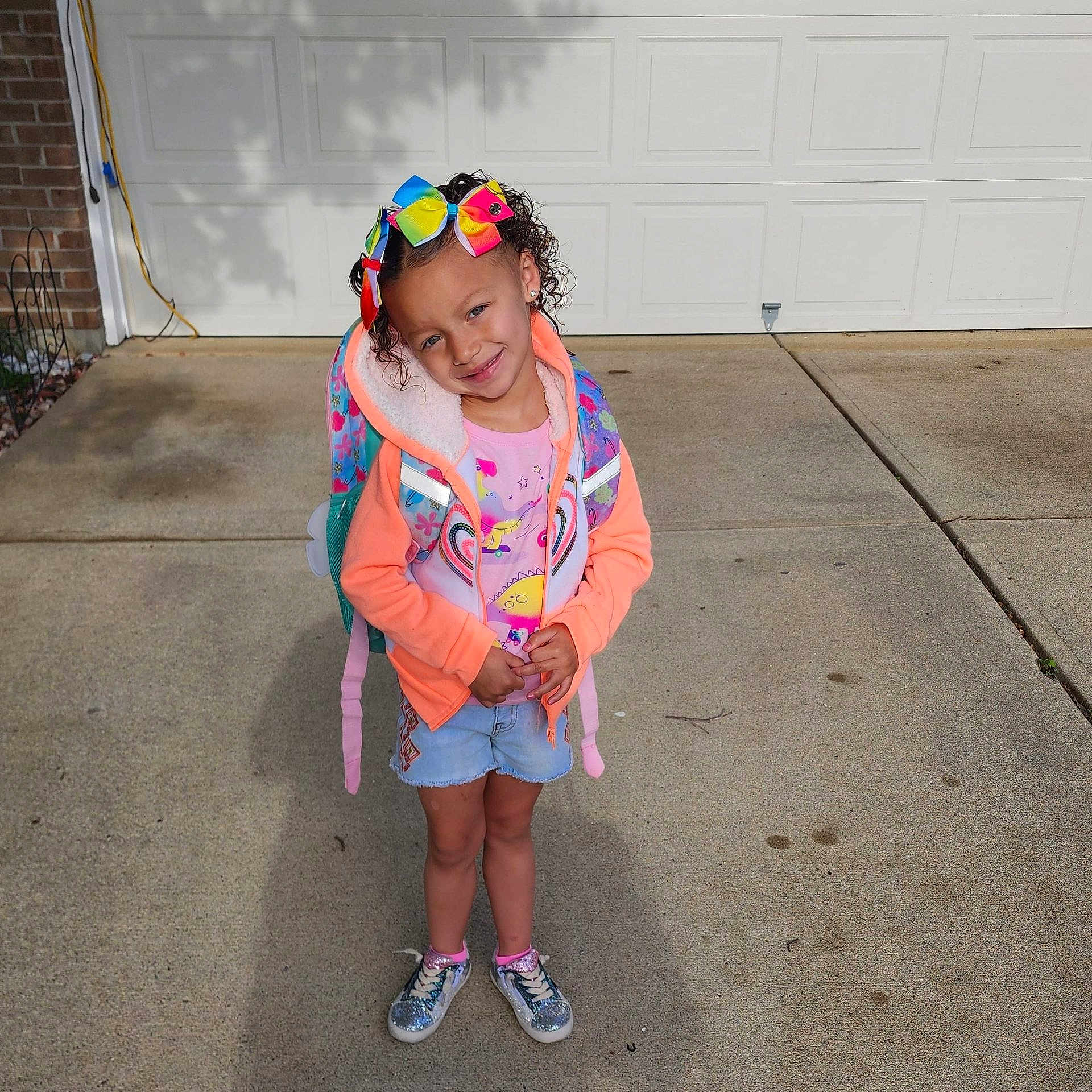 Emory joined the competition — help win amazing prizes! child, city, clothing, coat, costume, face, female, footwear, girl, head, jacket, path, person, photography, portrait, road, shoe, shorts, street, urban