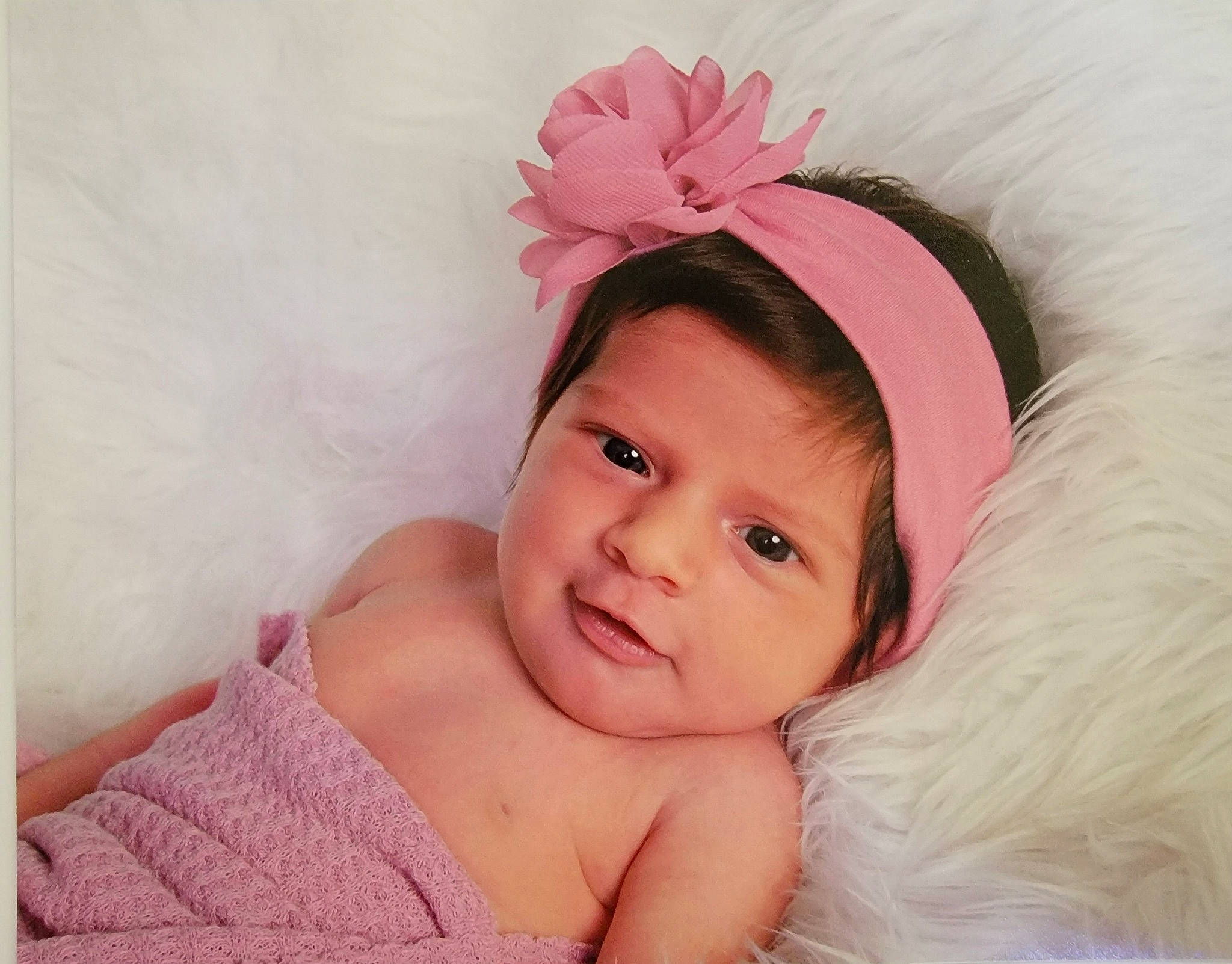 Celeste is registered to the contest to win money with this photo: baby, baby_toddler_clothing, child, comfort, costume_accessory, eyebrow, eyelash, fashion_accessory, flash_photography, fur, hair_accessory, happy, headpiece, magenta, person, petal, pink, portrait_photography, sleeve, smile