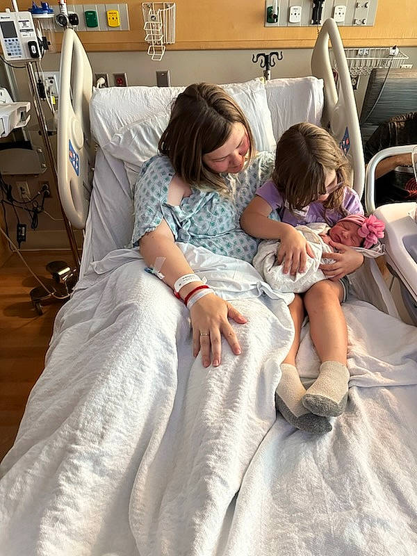 Celeste is registered to the contest to win money with this photo: baby, bed, bedding, bridal_clothing, comfort, dress, event, fashion_design, happy, health_care, hospital, hospital_bed, linens, medical, medical_equipment, patient, person, service, shoulder, textile