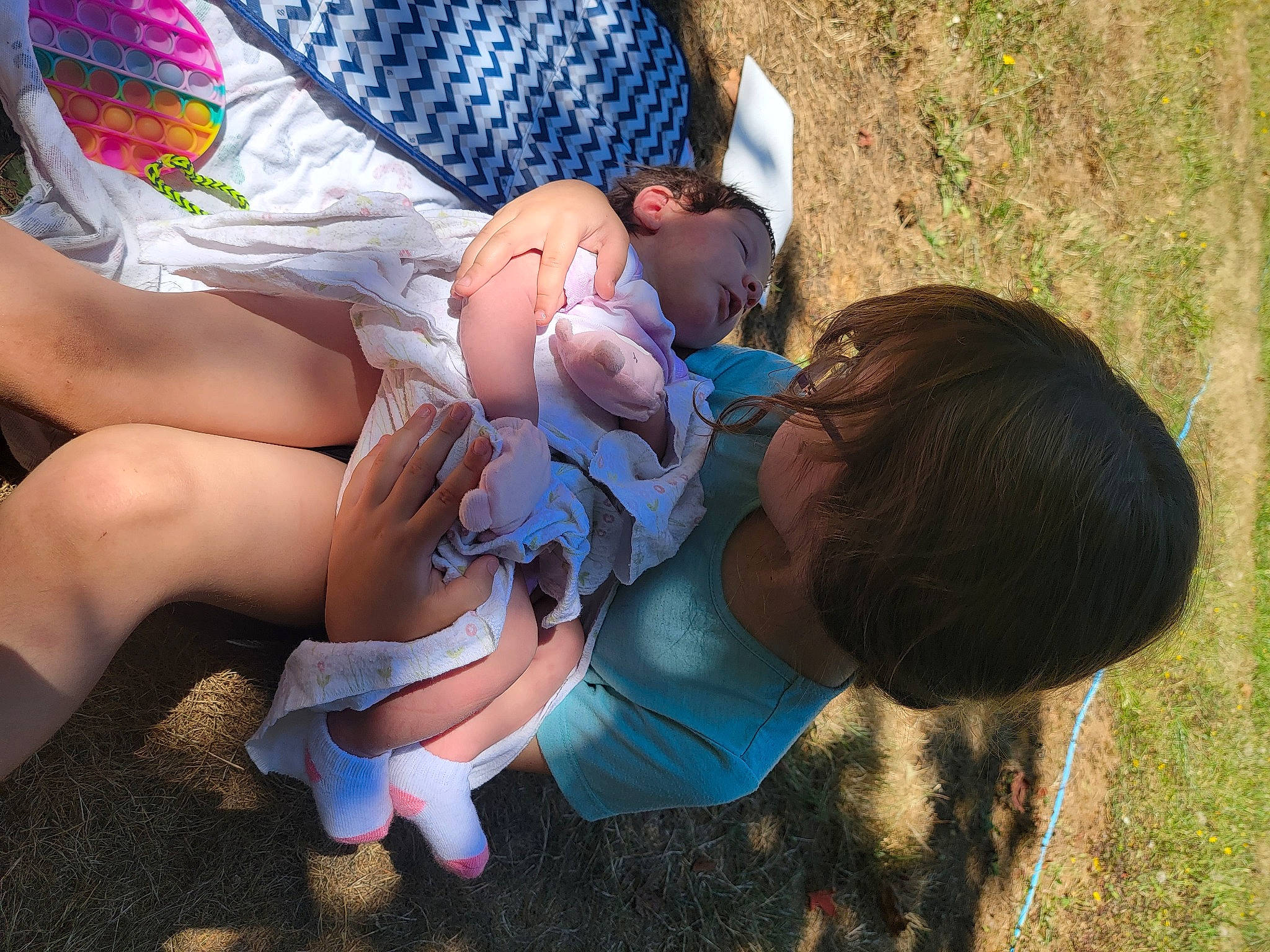 Zeah is registered to the contest to win money with this photo: arm, baby, child, eyewear, fun, glasses, grass, hand, happy, hat, human_leg, knee, leisure, people, person, plant, shorts, sunglasses, thigh, toddler