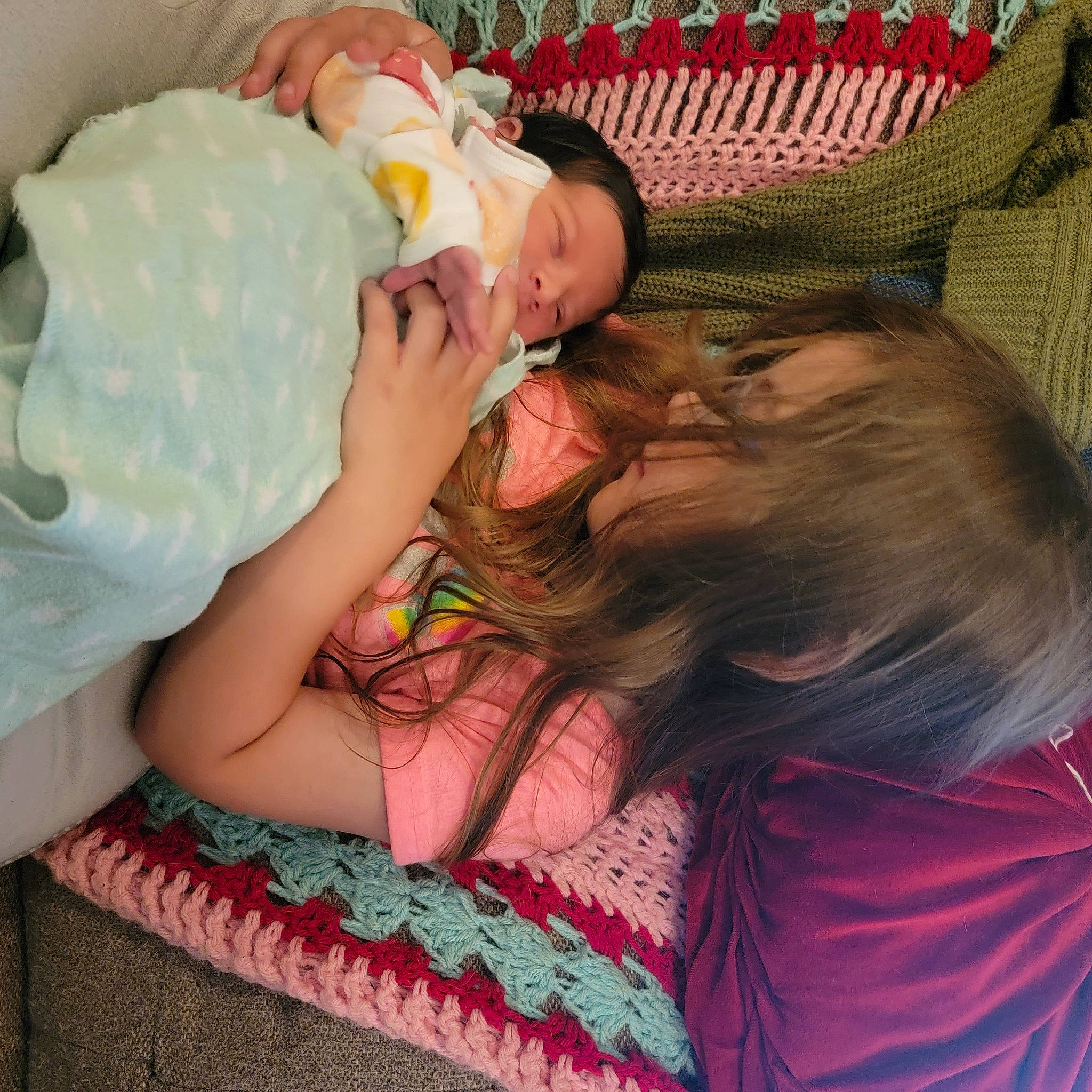 Zeah is registered to the contest to win money with this photo: baby, baby_products, baby_toddler_clothing, bedtime, child, comfort, couch, fun, green, happy, hat, head, linens, magenta, pattern, person, pink, room, skin, textile