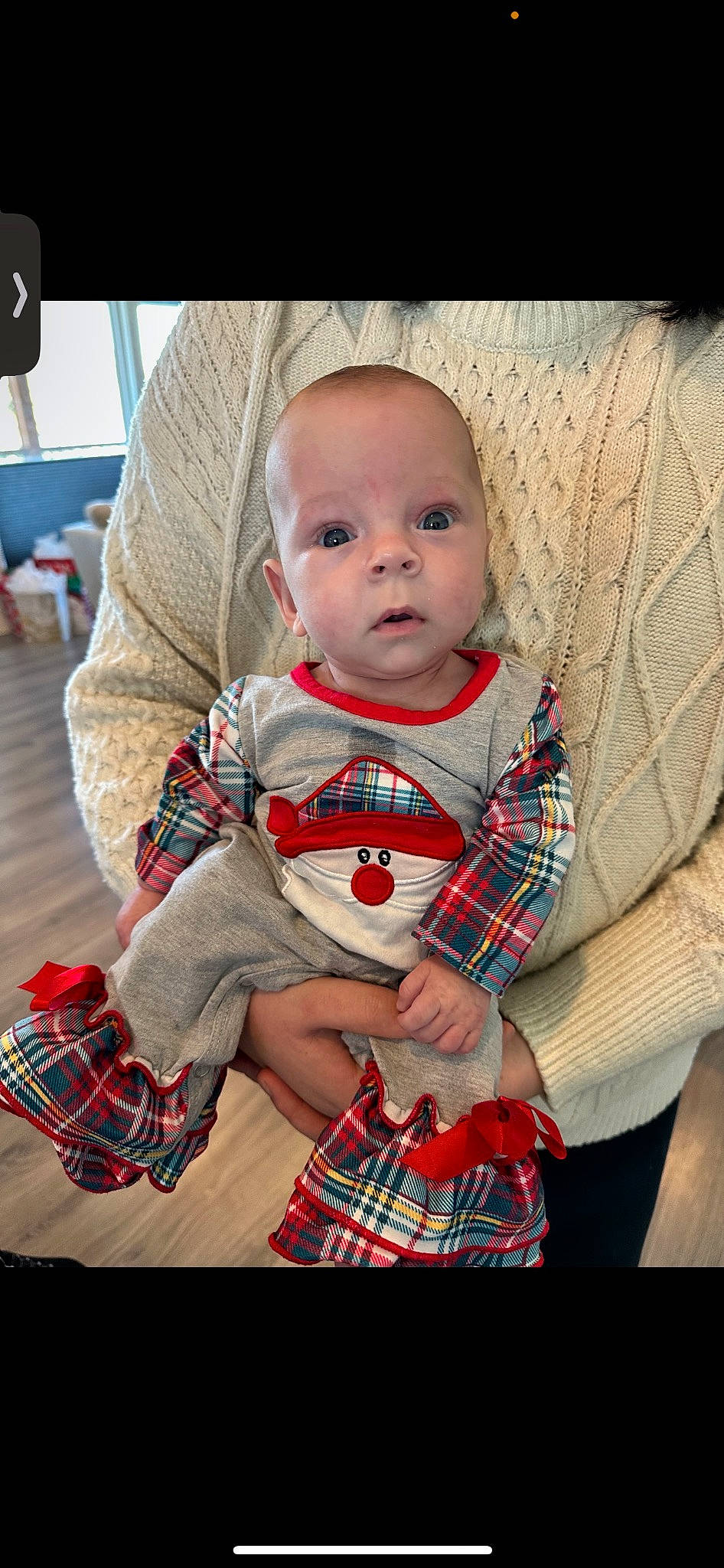 Aubrey is registered to the contest to win money with this photo: baby, baby_toddler_clothing, black, carmine, child, comfort, couch, event, lap, pattern, person, plaid, red, sitting, skin, sleeve, tartan, television, textile, toddler