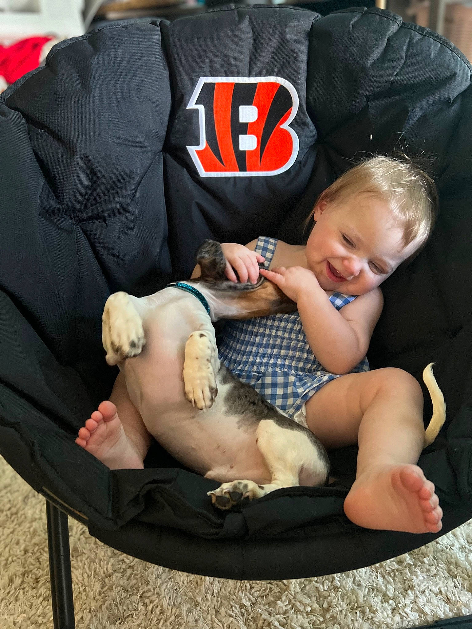 Laynee joined the competition — help win amazing prizes! baby, baby_carriage, baby_products, baby_toddler_clothing, bag, comfort, grass, hand, human_leg, lap, leg, mammal, person, product, shorts, sitting, sleeve, thigh, toddler, vertebrate