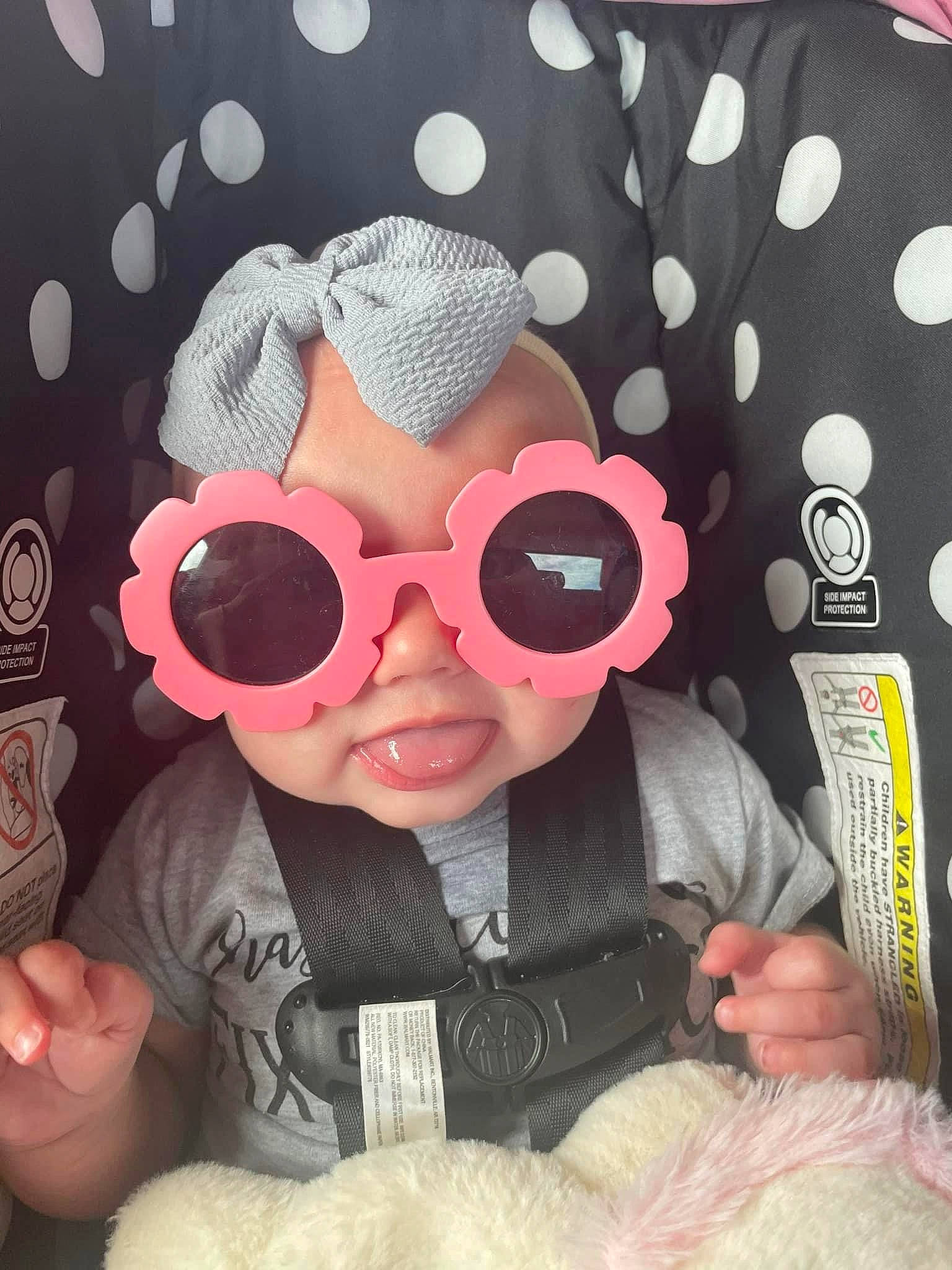 Sophia joined the competition — help win amazing prizes! baby, baby_toddler_clothing, cap, cool, costume_hat, eyewear, glasses, goggles, happy, hat, headgear, headwear, pattern, person, personal_protective_equipment, pink, sleeve, sun_hat, sunglasses, textile