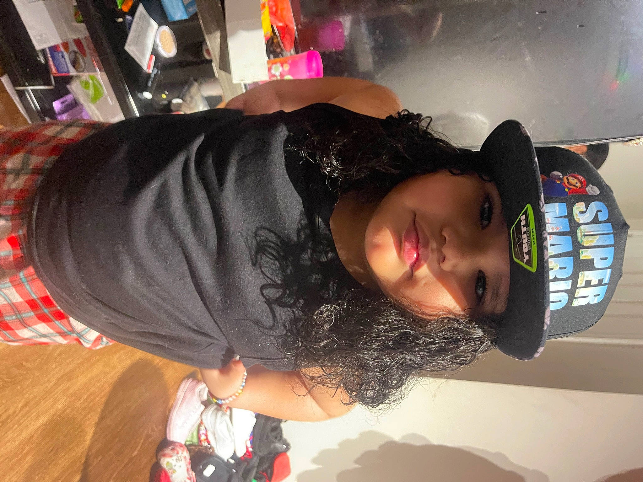 Jeremiah is registered to the contest to win money with this photo: arm, black_hair, cool, elbow, eyewear, fashion_accessory, fun, hat, headgear, headwear, party, person, personal_protective_equipment, room, t_shirt