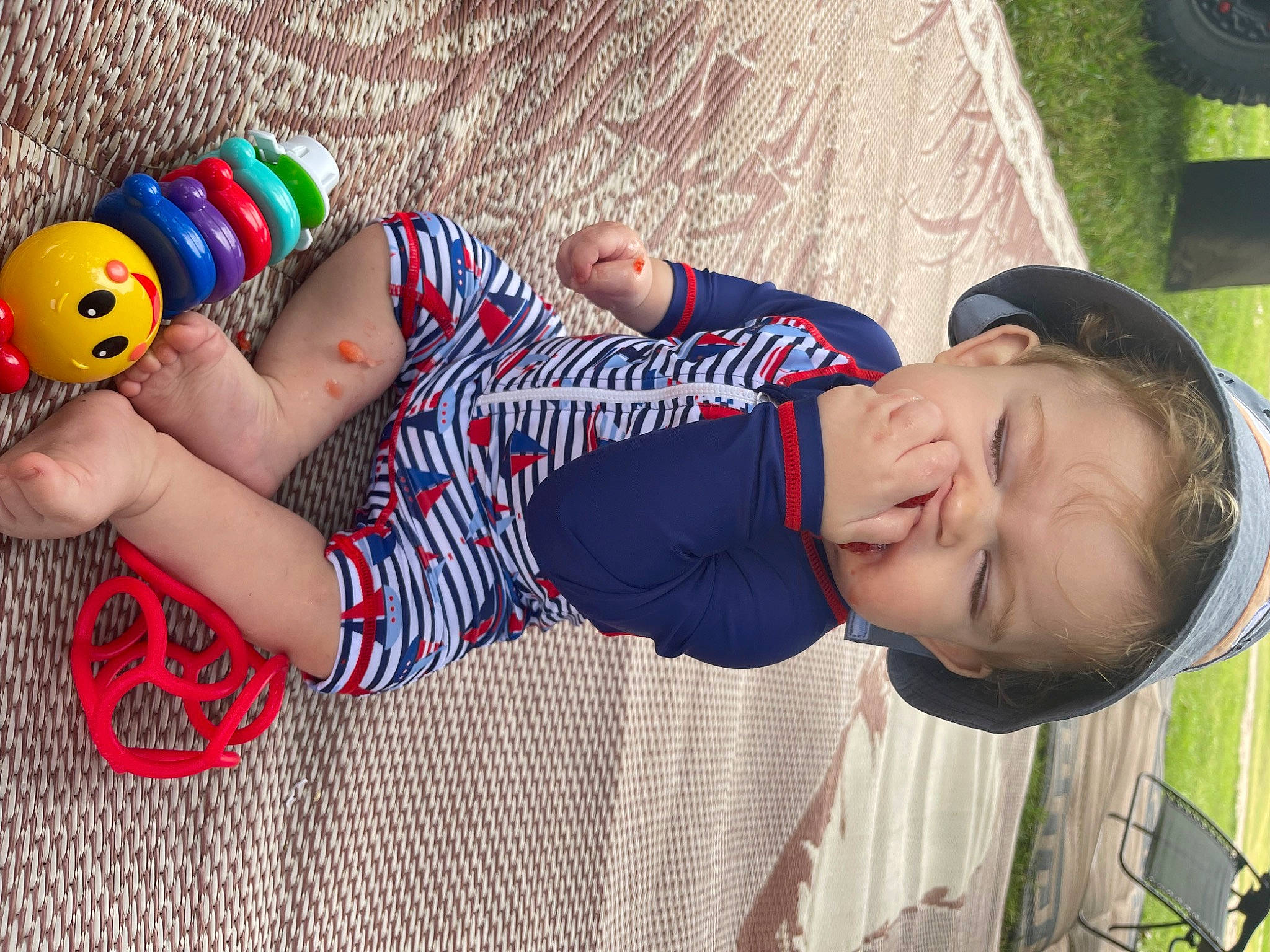 Tripp joined the competition — help win amazing prizes! arm, baby, baseball_cap, cap, child, clothing, elbow, foot, fun, grass, happy, hat, human_leg, leisure, nail, person, stuffed_toy, t_shirt, thigh, toddler