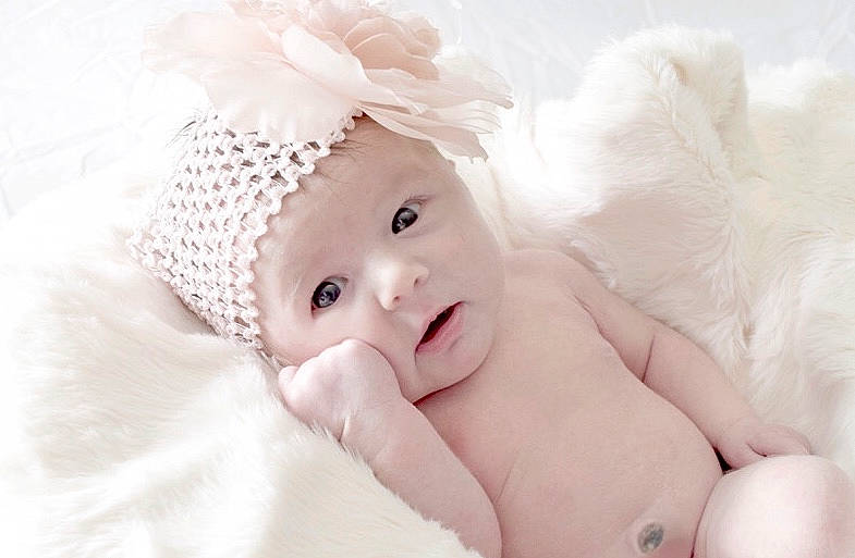 Lana is registered to the contest to win money with this photo: baby, baby_sleeping, cheek, child, child_model, costume_accessory, face, fashion_accessory, fur, hair_accessory, headgear, headwear, nose, person, photograph, photography, pink, portrait_photography, skin, smile