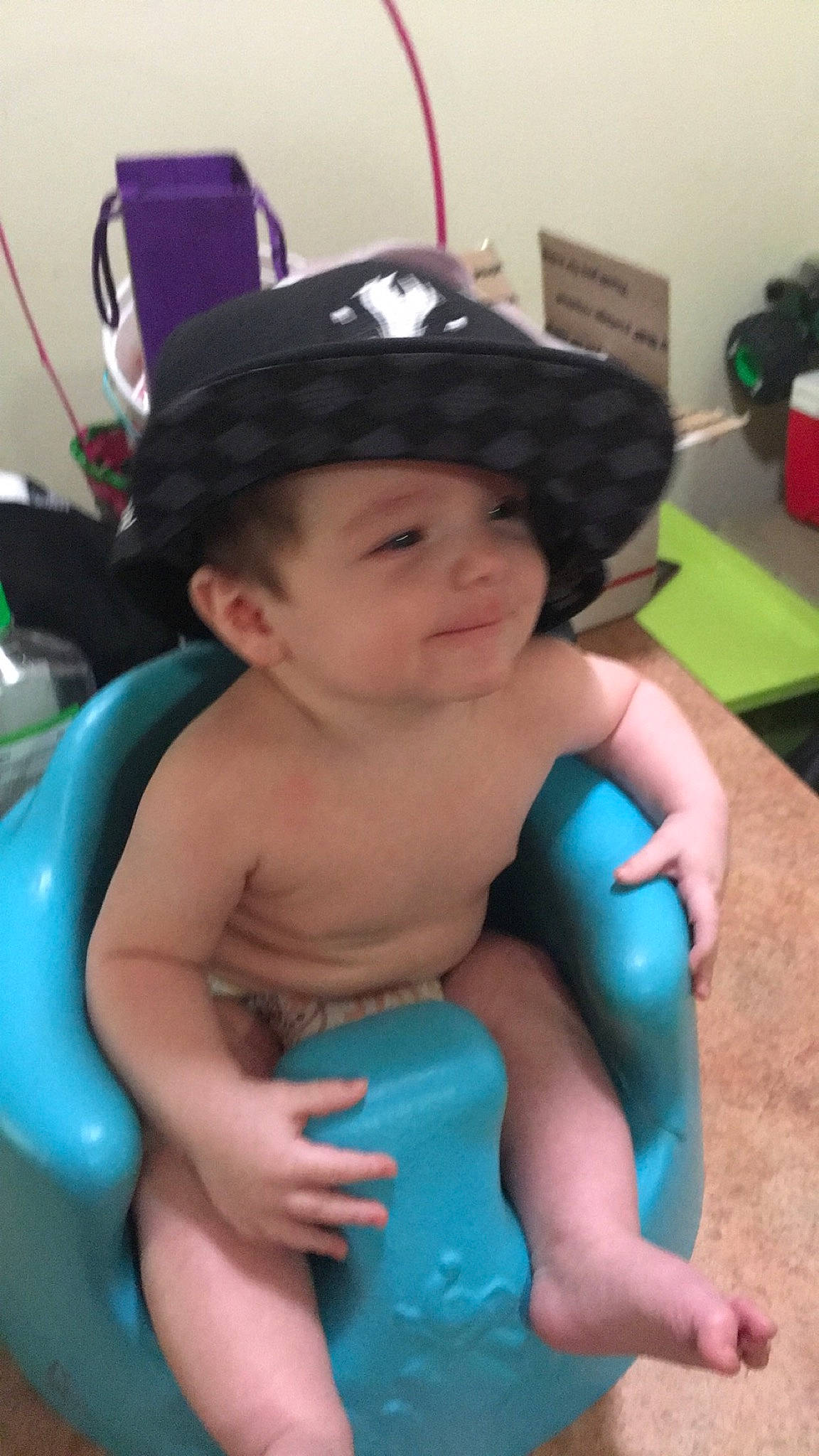 Kody is registered to the contest to win money with this photo: arm, baby, black_hair, child, headgear, headwear, leg, leisure, neck, person, play, smile, thumb, toddler