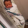 Kingston joined the competition — help win amazing prizes! newborn, baby, infant, sleeping, hospital, bassinet, blanket, hat, striped, wrapped, cute, face, person, indoors, bed, resting, skin, head, hospital_room, peaceful
