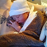Kingston joined the competition — help win amazing prizes! newborn, baby, sleeping, hat, towel, tattoo, butterfly_tattoo, heart_tattoo, arm, hand, skin, hospital, iv_drip, closeup, rest, peaceful, person, human, infant, parent