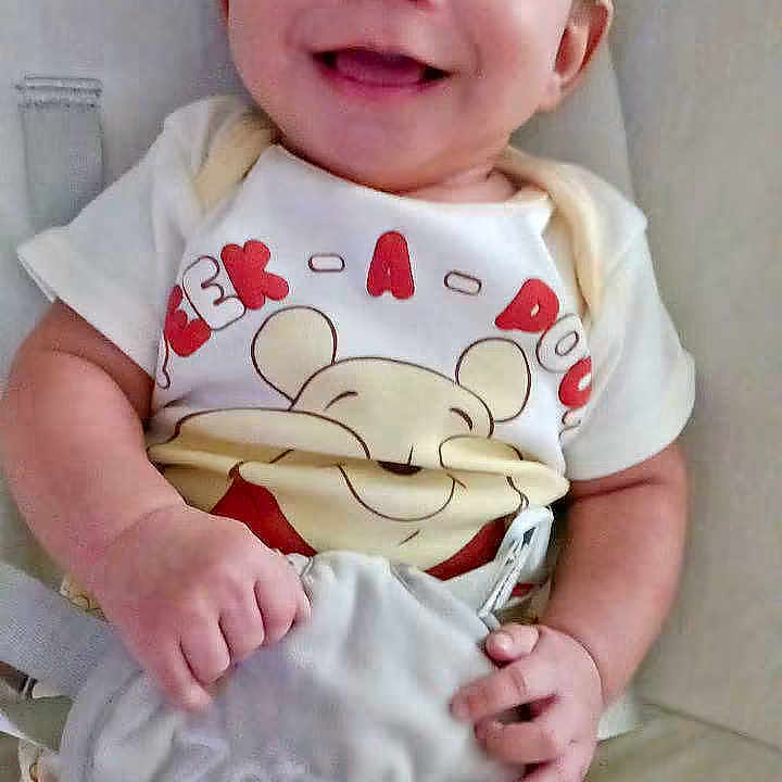 Kingston Carmean is registered to the contest to win money with this photo: baby, smiling, infant, child, winnie_the_pooh, plush_toy, clothing, cute, happy, sitting, soft_toy, indoors, portrait, person, young_child, baby_clothes, hand, face, seat, comfort