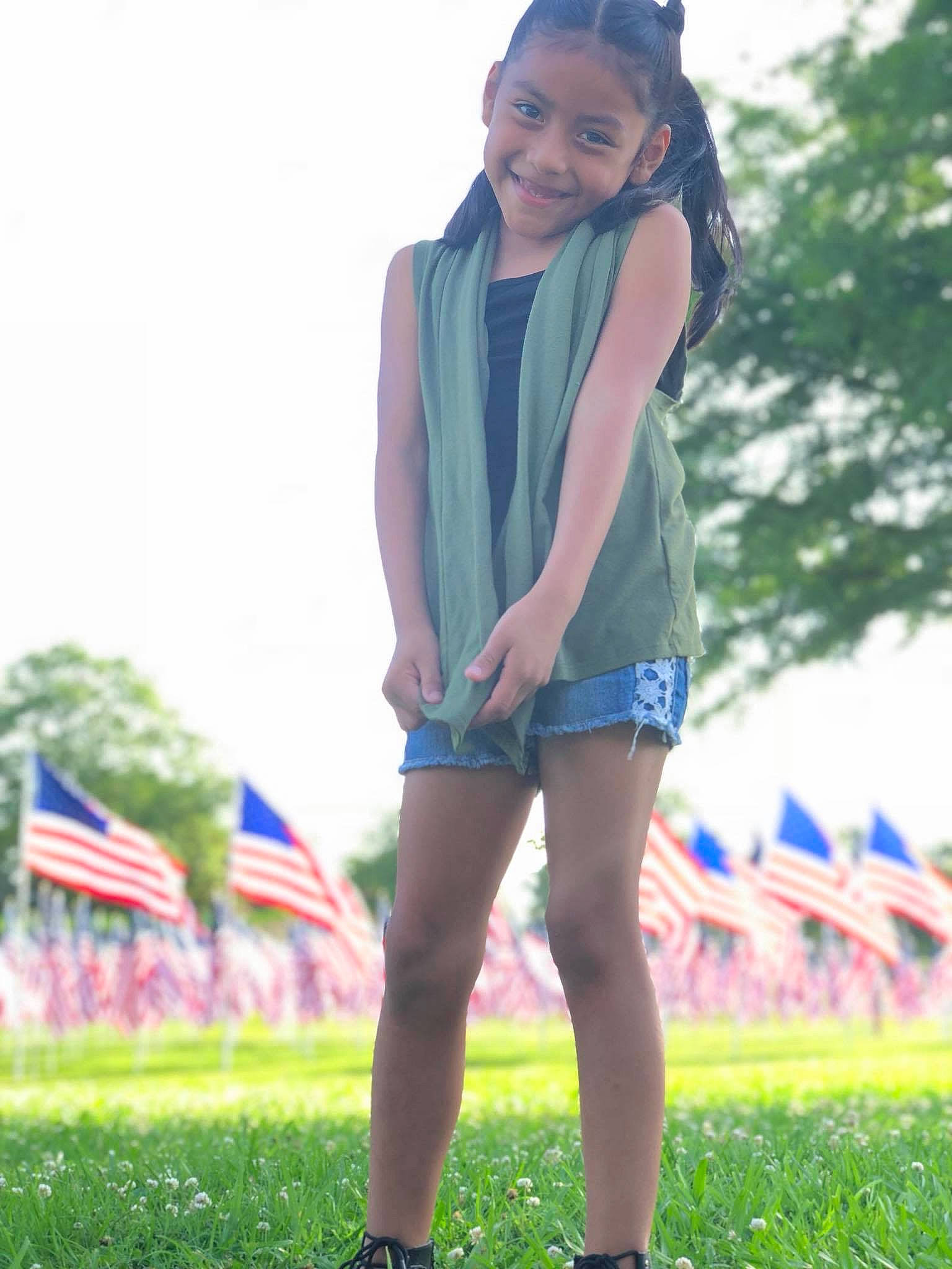 Alyson joined the competition — help win amazing prizes! clothing, footwear, grass, joy, leg, long_hair, person, photography, shorts, style, thigh, uniform