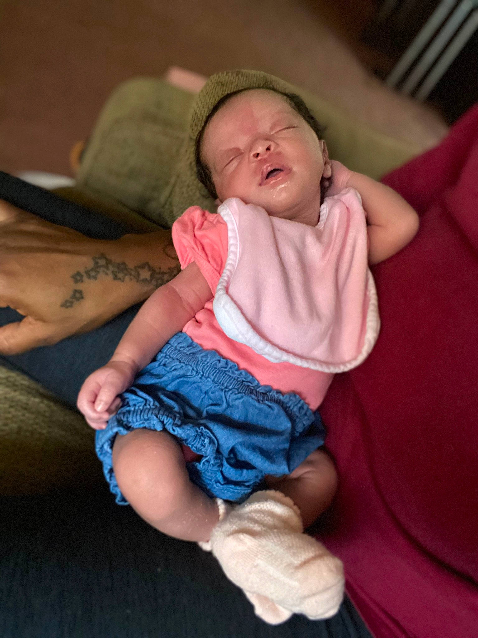 Journee is registered to the contest to win money with this photo: baby, baby_toddler_clothing, cheek, comfort, eye, finger, flash_photography, fun, head, human_body, human_leg, iris, joint, mouth, person, pink, purple, sitting, skin, sleeve