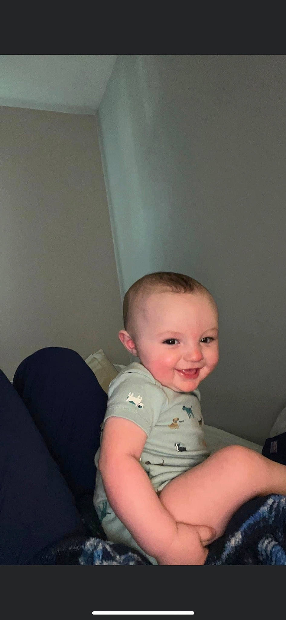 Frankie is registered to the contest to win money with this photo: baby, baby_toddler_clothing, cheek, child, chin, comfort, elbow, eye, flash_photography, floor, flooring, fun, iris, joy, person, shoulder, sitting, skin, sleeve, smile