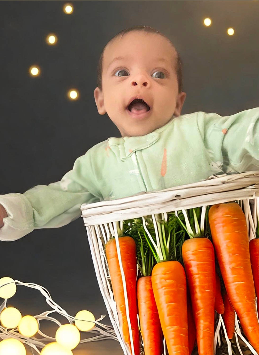 Tala is registered to the contest to win money with this photo: baby, baby_toddler_clothing, child, event, food, hand, happy, ingredient, local_food, natural_foods, orange, person, plant, produce, product, root_vegetable, sleeve, toddler, vegetable, whole_food