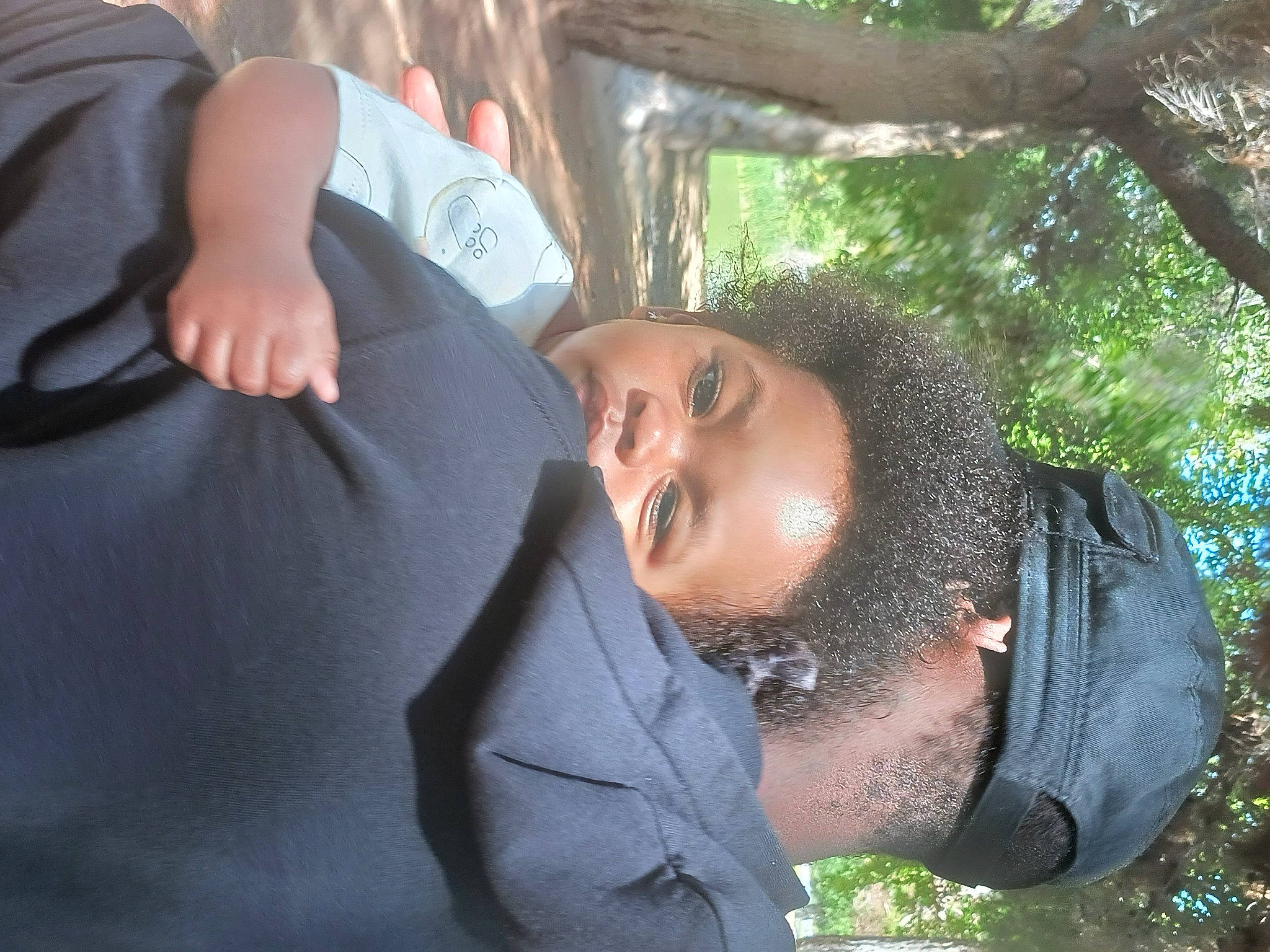 Nakia is registered to the contest to win money with this photo: beard, child, event, facial_hair, formal_wear, fun, gesture, grass, happy, laugh, leisure, moustache, people_in_nature, person, smile, t_shirt, tree, vacation