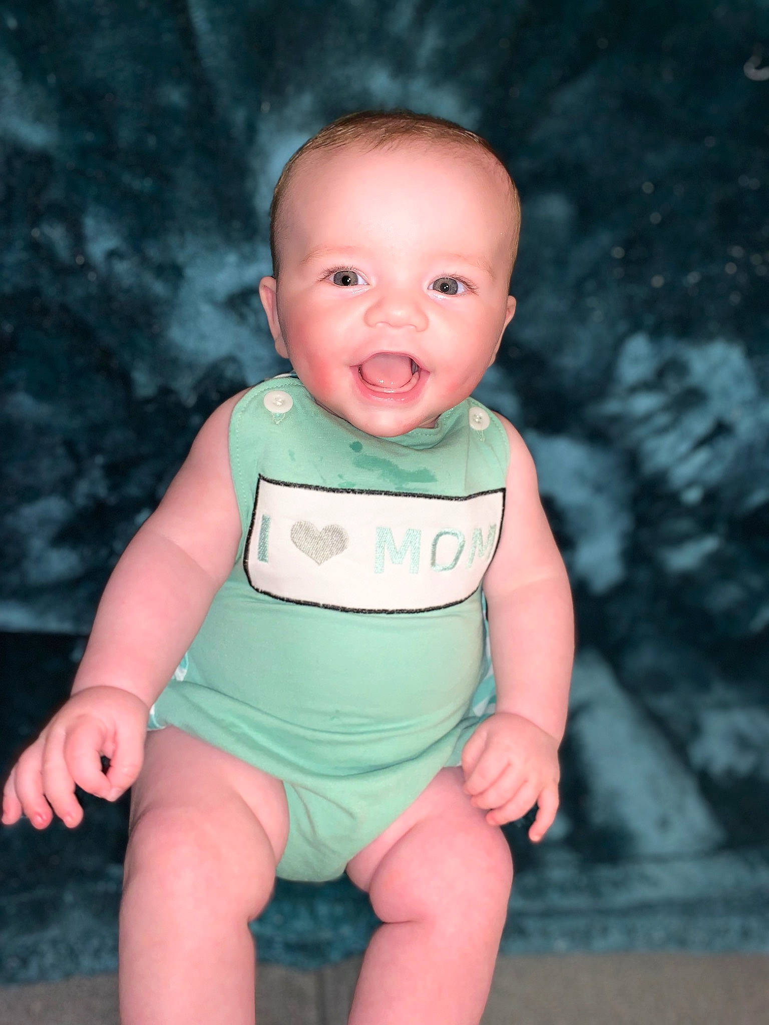 Keagan is registered to the contest to win money with this photo: baby, baby_toddler_clothing, cheek, dress, eye, face, finger, flash_photography, happy, head, human_body, jeans, lip, neck, person, pink, skin, sleeve, smile, stomach