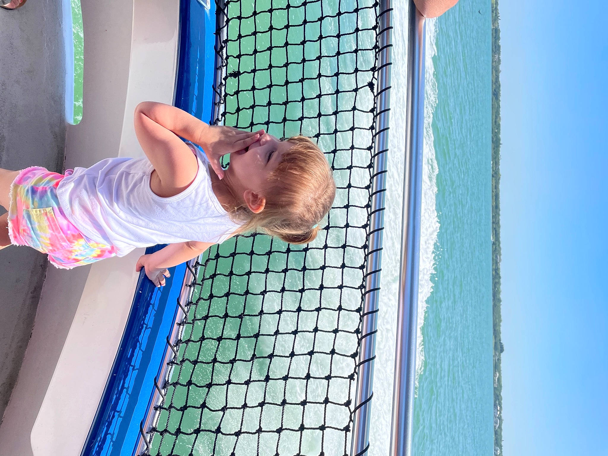 Aubriella is registered to the contest to win money with this photo: azure, baby, baby_products, baby_toddler_clothing, blue, child, electric_blue, fun, happy, leisure, line, mesh, net, pattern, person, play, recreation, sky, toddler, vacation