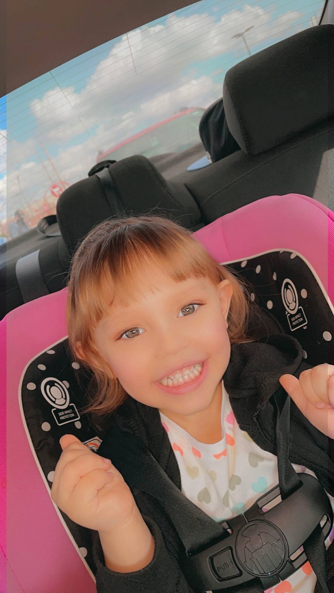 Aubriella is registered to the contest to win money with this photo: auto_part, automotive_design, automotive_exterior, black_hair, car, car_seat, car_seat_cover, eye, face, head_restraint, joy, motor_vehicle, person, personal_luxury_car, product, skin, smile, steering_part, steering_wheel, toddler