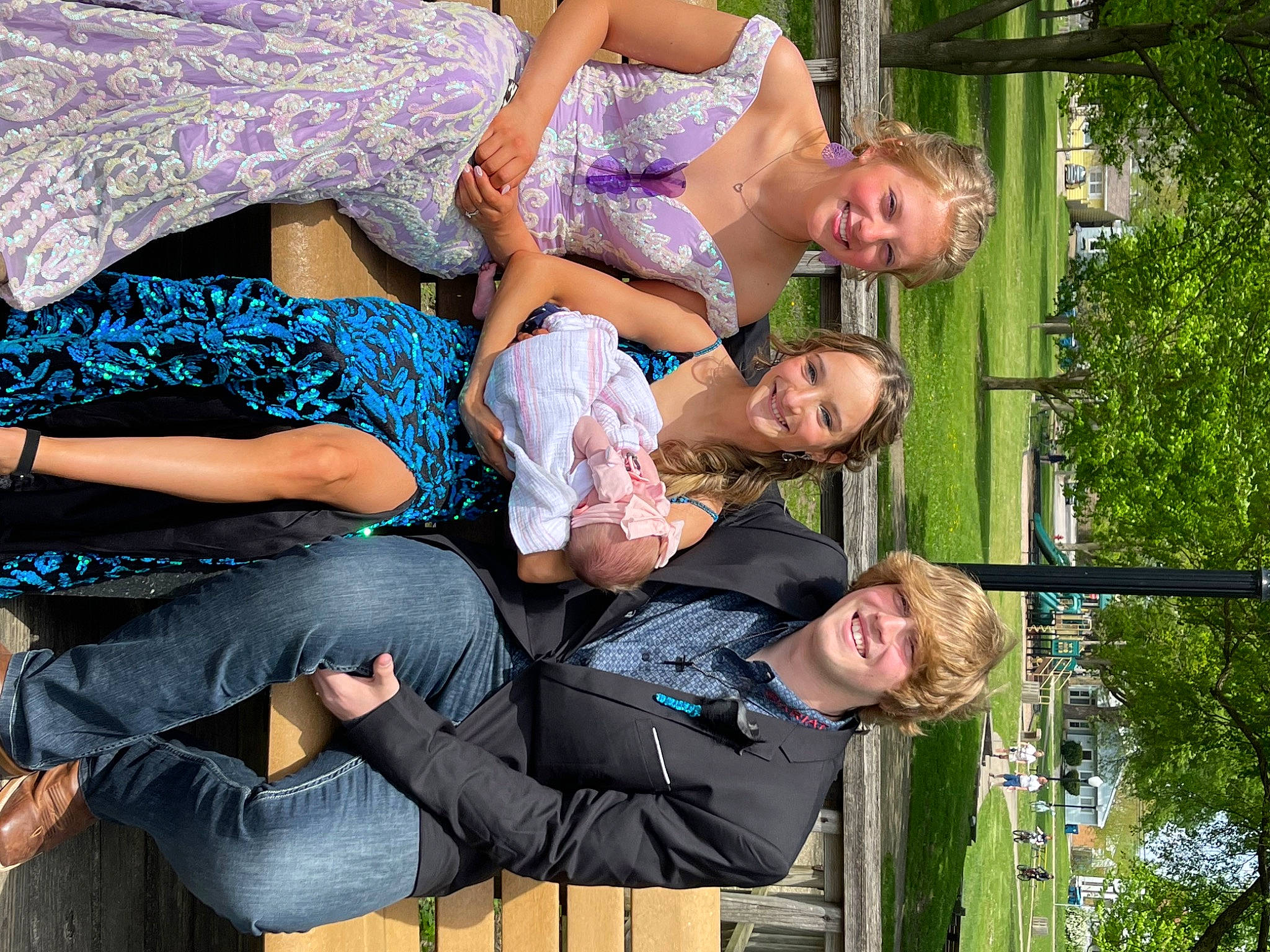 Brynleigh joined the competition — help win amazing prizes! clothing, event, fun, grass, green, happy, human_leg, jeans, joy, leisure, luggage_and_bags, person, plant, recreation, sitting, smile, snapshot, thigh, tree