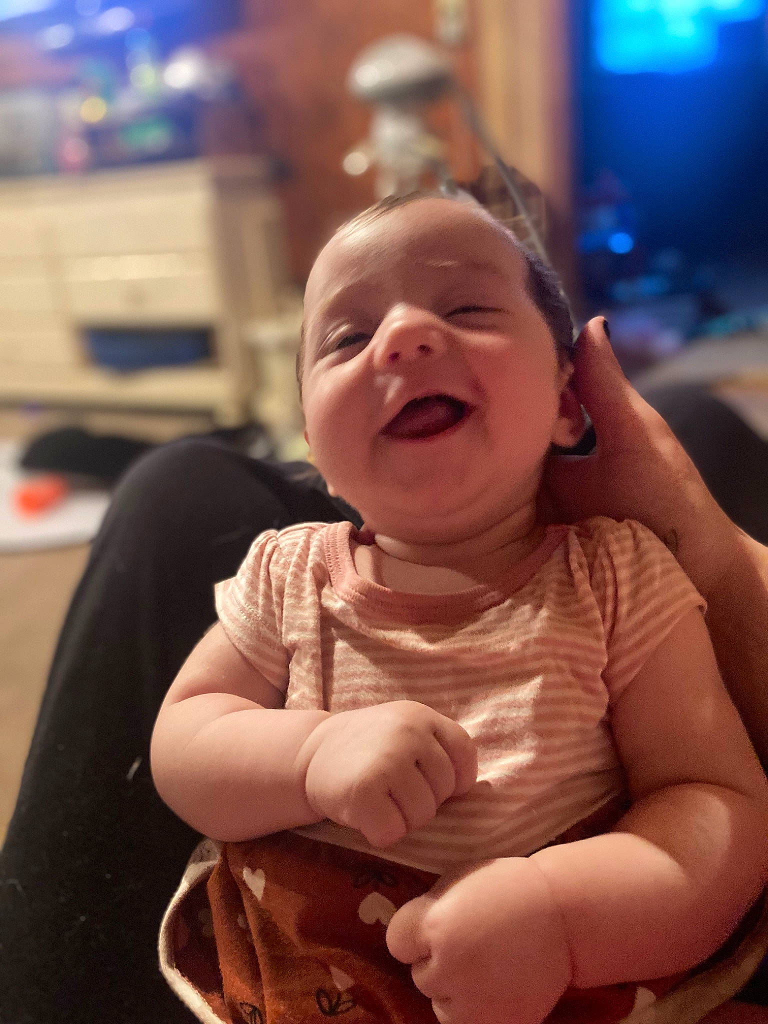 Heaven is registered to the contest to win money with this photo: baby, baby_toddler_clothing, cheek, child, chin, dress, event, facial_expression, finger, fun, happy, iris, lip, mouth, nose, person, sitting, skin, smile, thumb